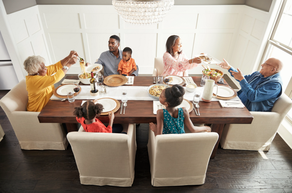 Family having breakfast at the dining table | Bram Flooring